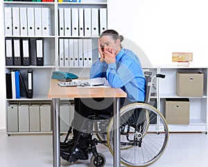 Disabled businessman in wheelchair is depressed