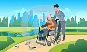 Disabled care. Young man walking with grandfather in wheelchair, public park summer landscape, physical therapy and