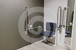 Disabled changing room with grab rails and seat doc m pack in shop store