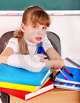 Disabled child with broken arm.