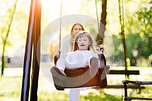 Disabled child enjoying the swing