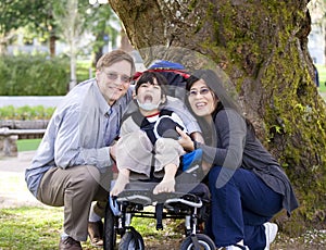 Disabled child surrounded by parents