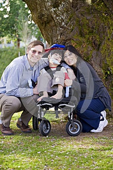 Disabled child surrounded by parents