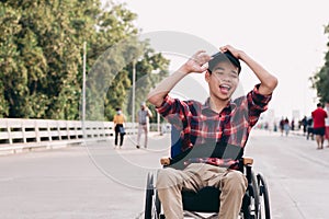 Disabled child on wheelchair is smiling