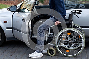 Disabled driver getting into a car