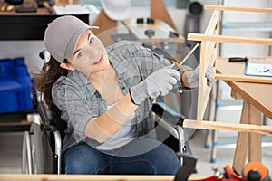 disabled female carpenter happy to work in carpentry photo