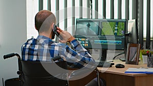 Disabled freelancer videographer talking on phone