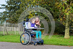 Disabled girl in a wheelchair relaxing outside