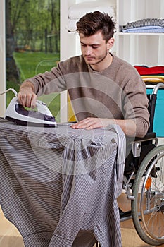 Disabled ironing shirts on board