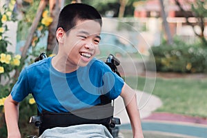 Disabled kid in garden with family in the outdoor