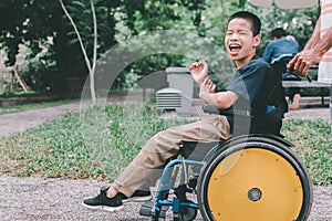 Disabled kid in travel holidays with family in the outdoor