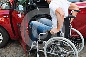 Disabled man boarding in his car