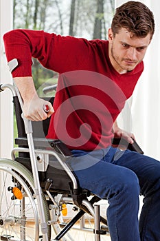 Disabled man with crutches