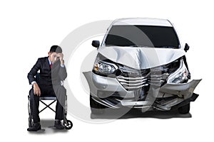 Disabled man and damaged car