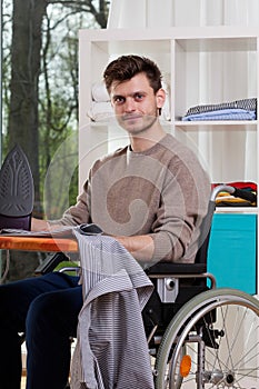 Disabled man with ironing board