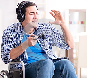 Disabled man playing computer games during rehabilitation
