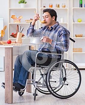 Disabled man preparing soup at kitchen