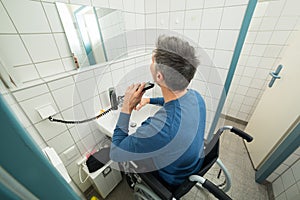 Disabled man trimming beard