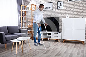 Disabled Man Using Crutches