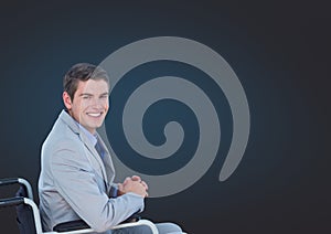 Disabled man in wheelchair with dark background