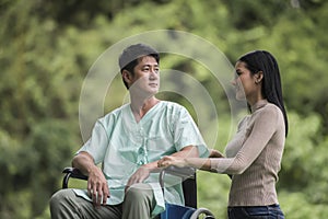 Disabled man in wheelchair and girlfriend