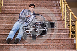 The disabled man on wheelchair having trouble with stairs