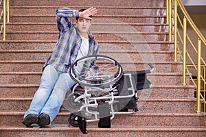 The disabled man on wheelchair having trouble with stairs