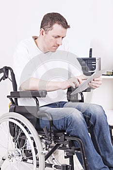 Disabled man in wheelchair at work