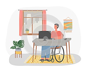 Disabled man in wheelchair working at computer in home. Freelance worker sitting at desk in front of desktop computer