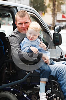 Disabled Men with son on Wheelchair Lift