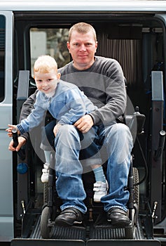 Disabled Men with son on Wheelchair Lift