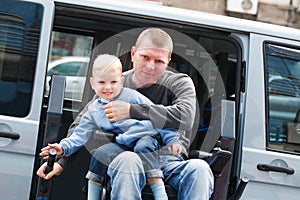 Disabled Men with son on Wheelchair Lift