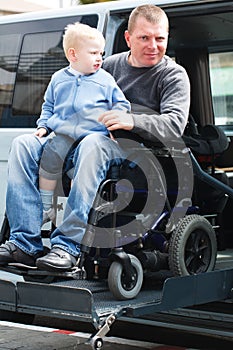 Disabled Men with son on Wheelchair Lift