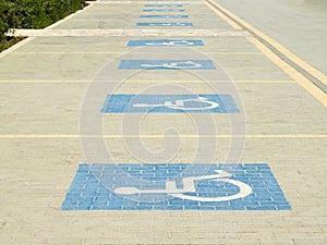 Disabled parking bays with blue handicap signs