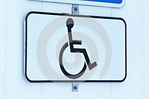 Disabled parking permit sign on white background.