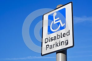 Disabled Parking sign against a blue sky.