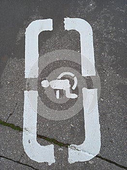 Disabled parking, stencil on asphalt.