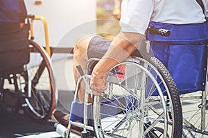 Disabled people sitting on wheelchair and going to the public bu