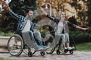 Disabled People on Wheelchairs Have Fun in Park.