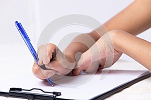 Disabled person hand without fingers since childhood brith, using pen to write word sentence on paper note. Woman use short