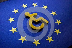 Disabled person sign on the EU flag. European accessibility act concept. photo