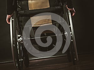 Disabled person sitting on wheelchair