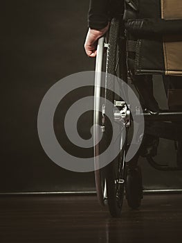 Disabled person sitting on wheelchair.