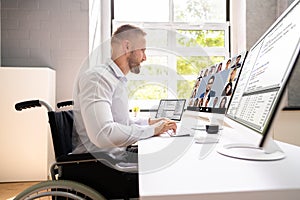 Disabled Professional Worker In Wheelchair Working