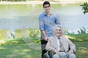 Disabled senior man and grandson