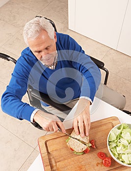 Disabled Senior Man Making Sandwich