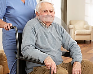 Disabled Senior Man Sitting In Wheelchair