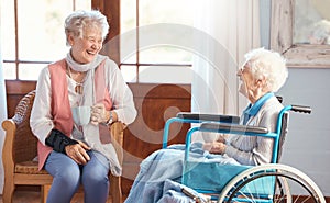 Disabled senior woman, friends and coffee with smile, funny conversation or talking with laugh, wheelchair or happy