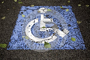 Disabled sign on the asphalt