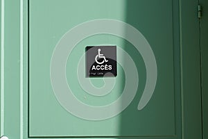 Disabled sign logo on door entrance store access pictogram on street shop